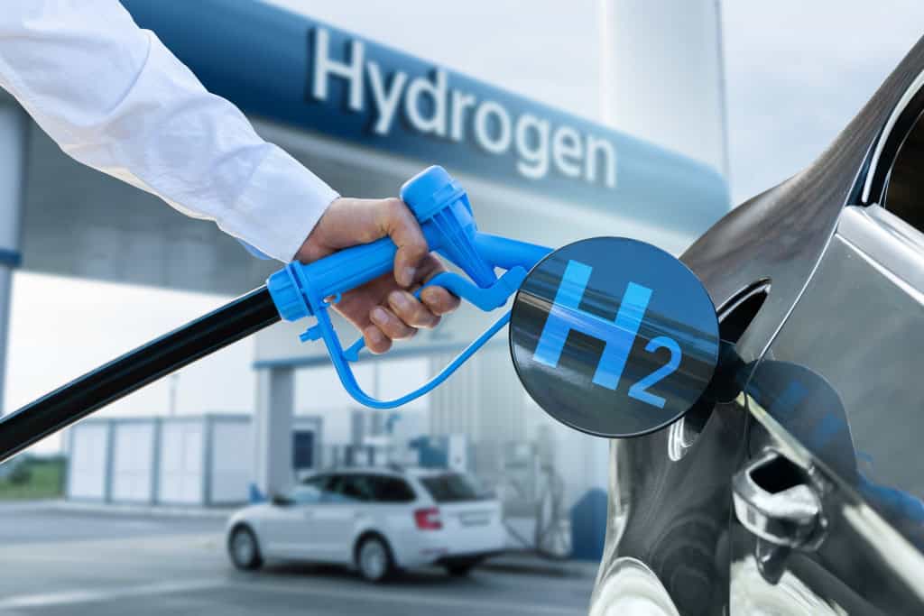 Simulação de um carro sendo abastecido, com o termo "hidrogênio" atrás